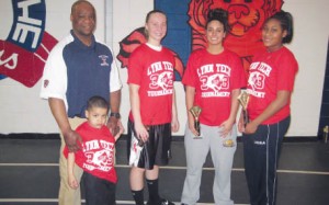 3-POINT LAND The Revere team of Christina Bagnera (RHS), Christina Cavagnaro (Simmons College), and Morgan Jenkins (RHS) won the women’s division of the Lynn Tech 3 on 3 Basketball Tournament Saturday at the Tech fi eldhouse. The winning trio is pictured with tournament director, Lynn Tech boys basketball coach Marvin Avery and his son, Marquese.